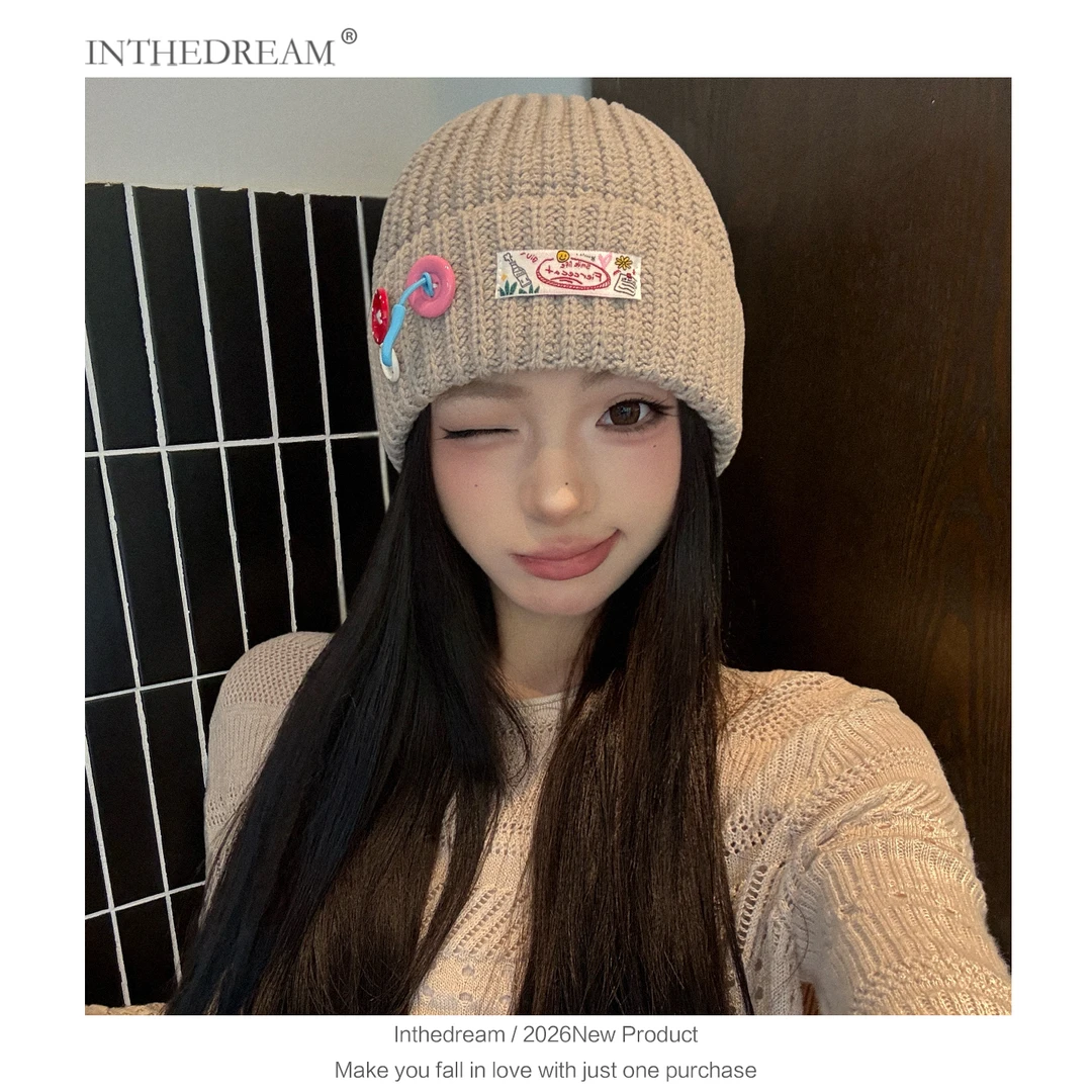 韩版纽扣毛线帽子女秋冬季个性堆堆帽显脸小保暖针织帽护耳冷帽子