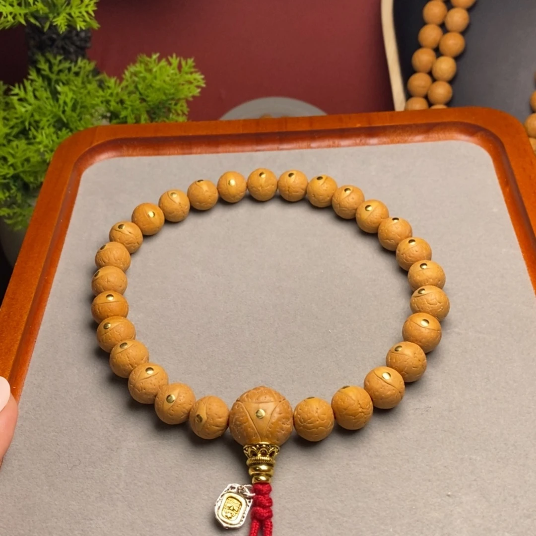 鄧***凤眼菩提手串12铜手持