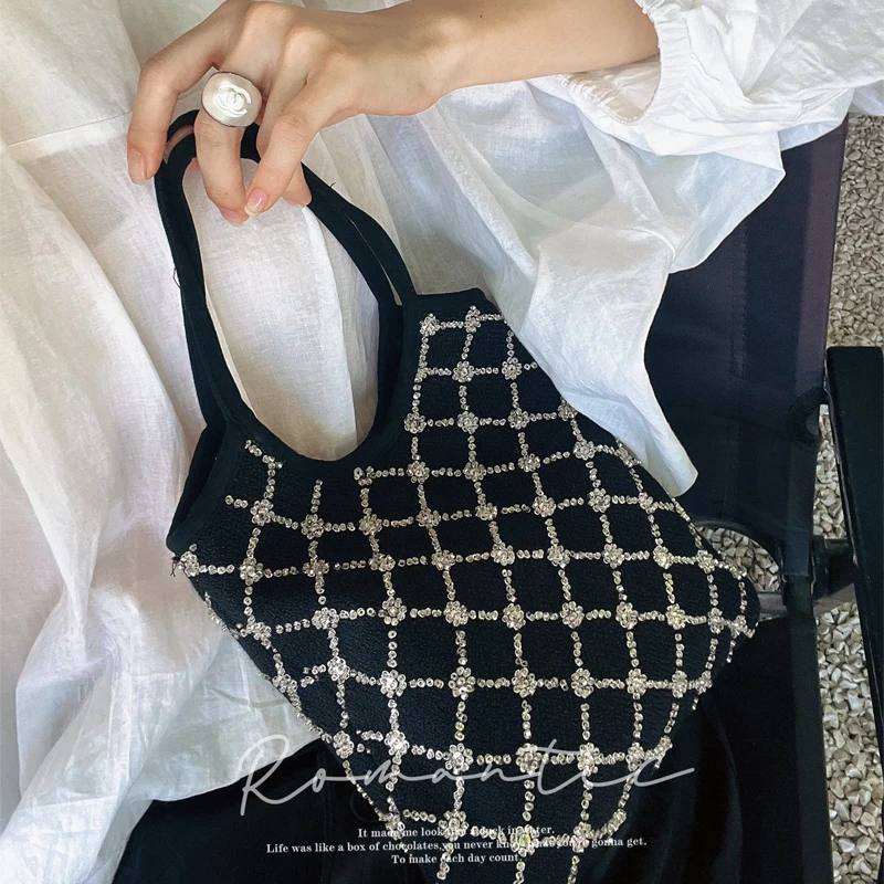 黑色羊毛手拎包复古格纹包女2025新款小众设计感手拿包手腕包