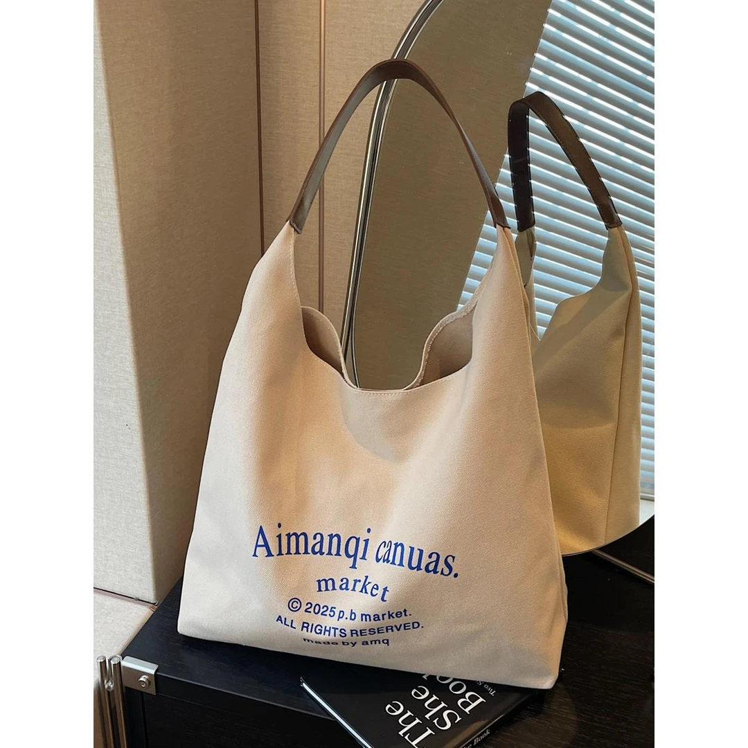 文艺字母帆布包女2025夏新款简约大容量托特包上班通勤单肩手提袋