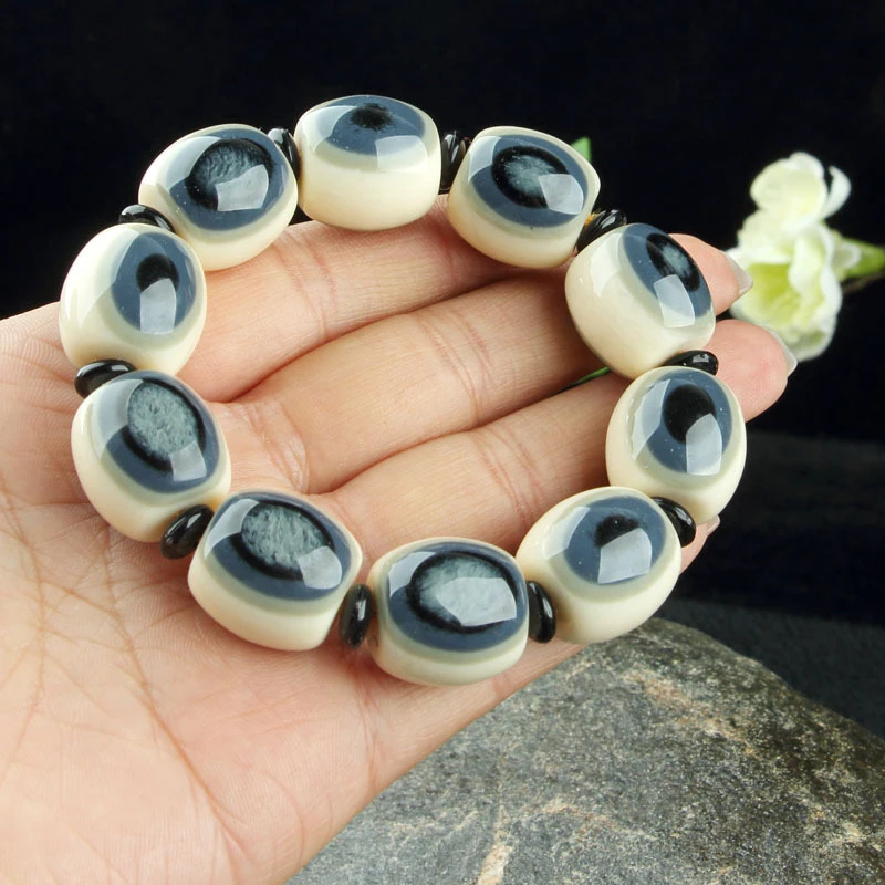 【闪购链接】精品猛犸牙蓝眼睛手串