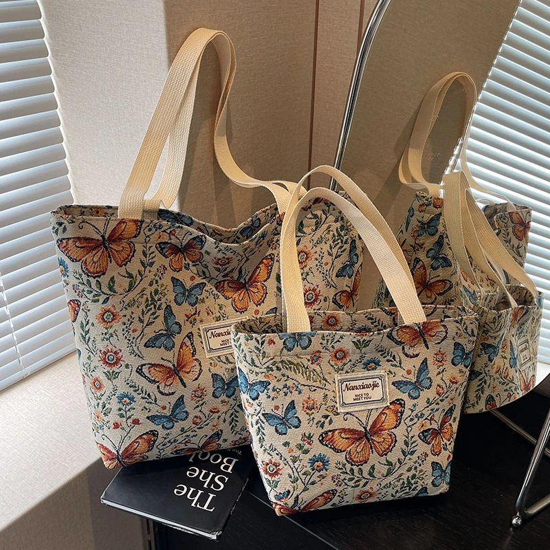 大容量单肩手提包包2025新款小众ins帆布包便携式托特上课通勤包