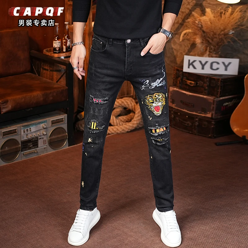 2025秋冬刺绣黑色牛仔裤男士高端爆款潮牌韩版弹力假破洞修身小脚