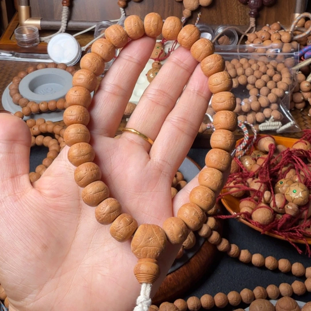 凤眼菩提把件藏切手持27颗