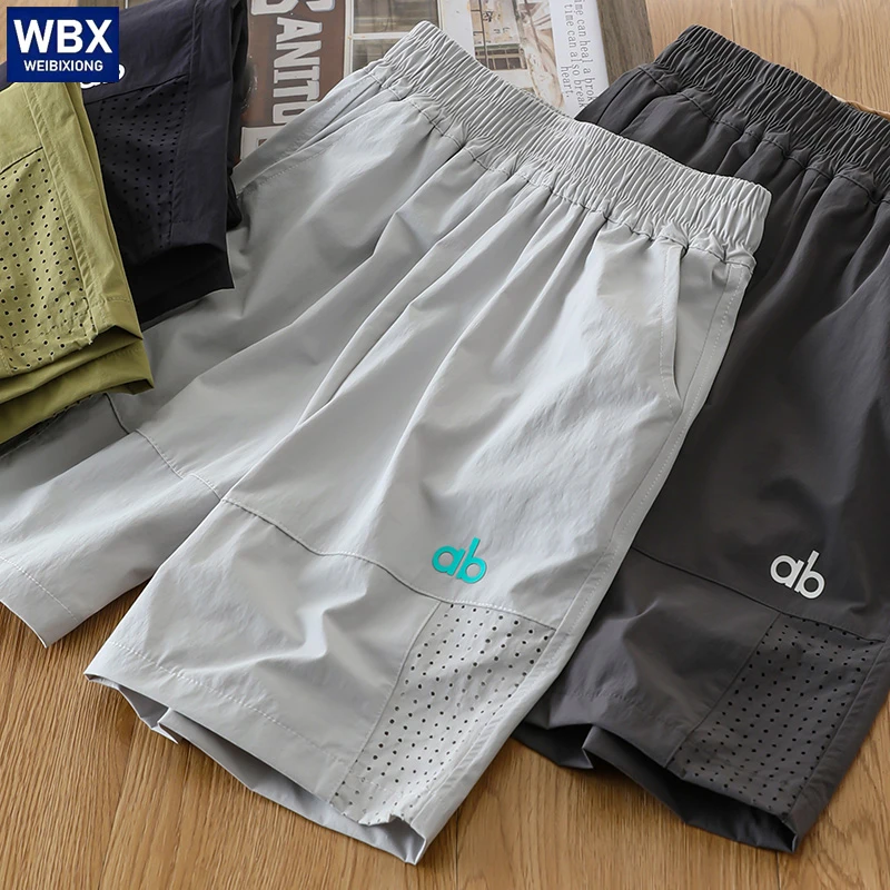 儿童夏速干网眼拼接休闲短裤中大童纯色百搭户外风五分裤2025新款