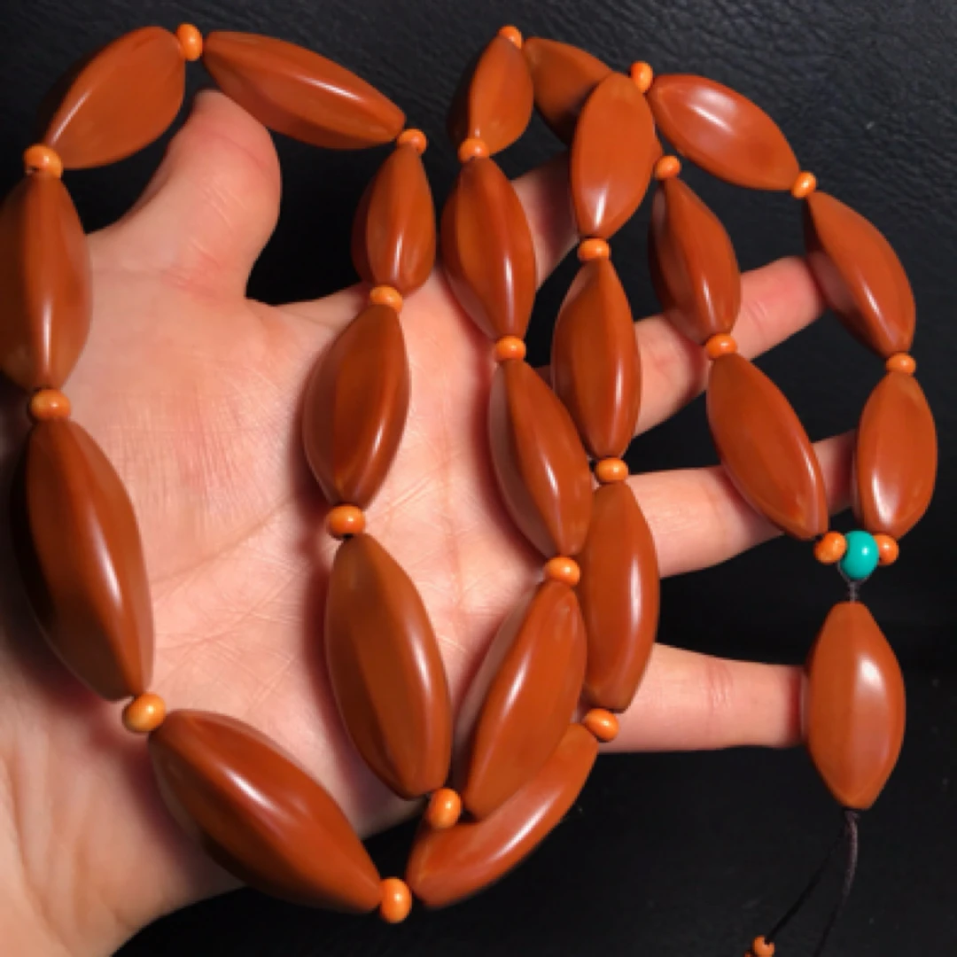 橄榄核手工打磨柳叶三棱正奔素珠脖挂尺寸1.5*3.3cm文玩老核男女