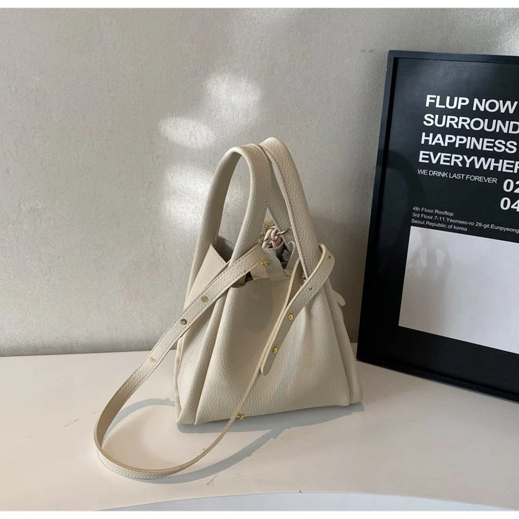 单肩包法式锁扣水桶包车缝线韩版百搭小众休闲简约通勤手提小包