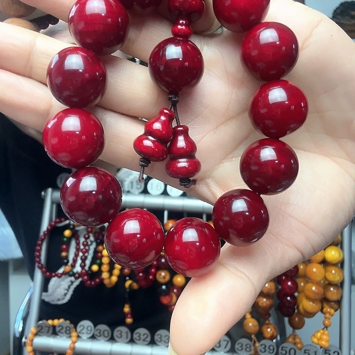 松木固化盘琥珀木手串1.8樱桃红男款