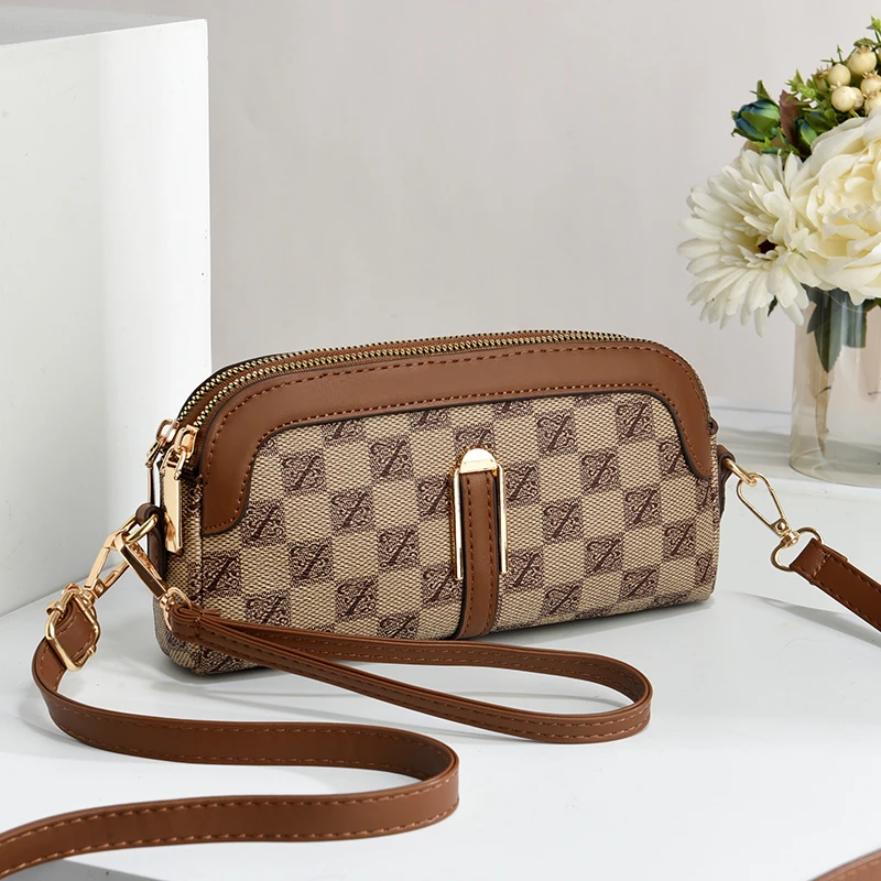 2025新款轻奢真皮质感包包女春季新款手拿包双隔层手机包单肩包