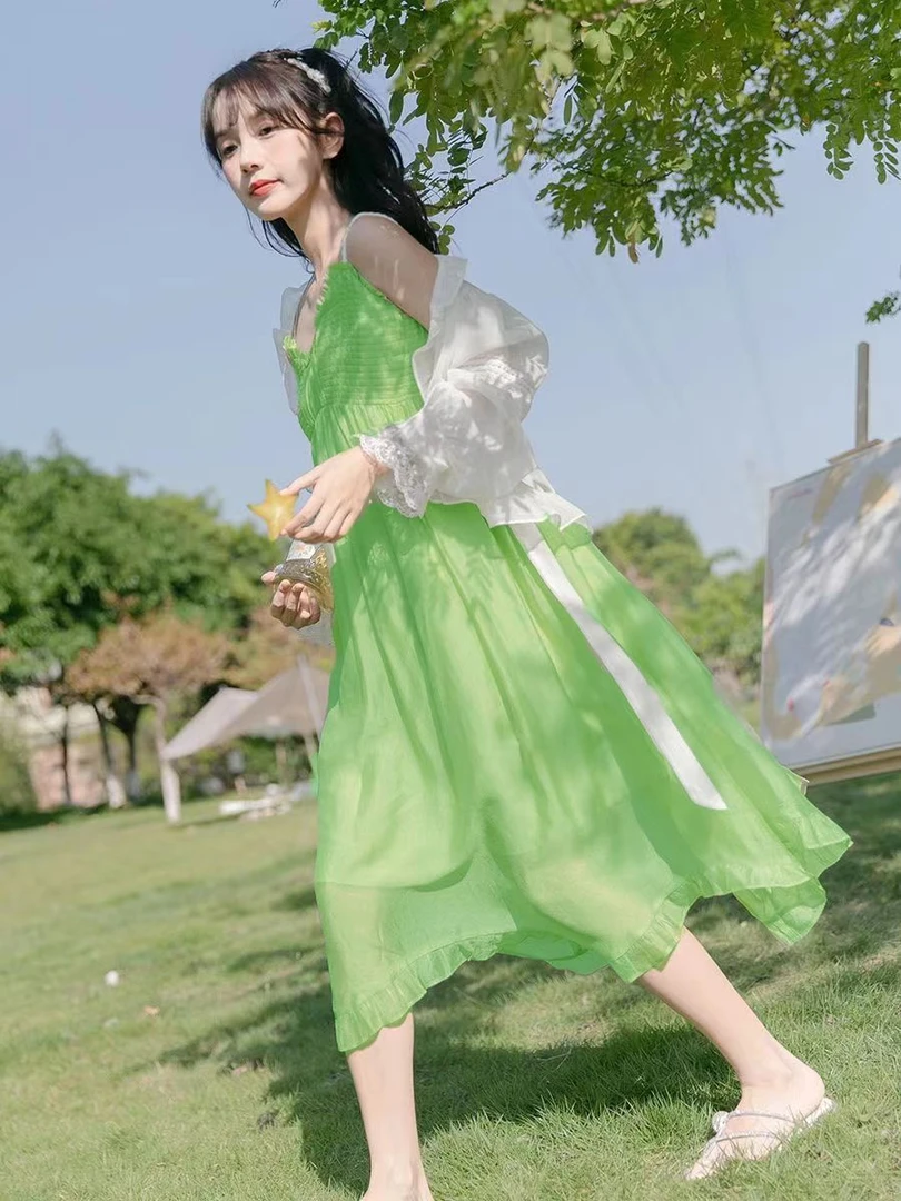 绿色吊带裙海边度假露背连衣裙三亚旅游法式小众显瘦性感沙滩裙