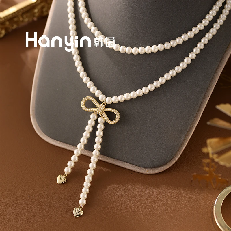 铜合金仿珍珠项链 48cm/6mm双层奶油白微镶蝴蝶结流苏圆珠项链AAA