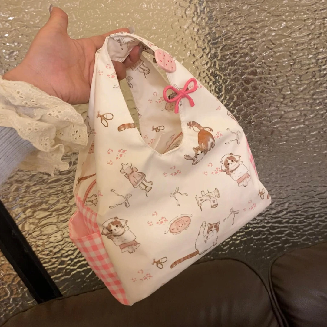 少女小众猫咪碎花手提包2025新款可爱百搭手拎包印花通勤便当包包