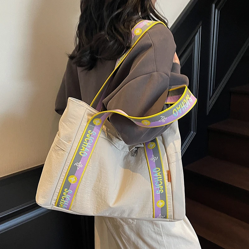 简约休闲帆布包大容量托特包包女2025夏季新款文艺字母百搭单肩包