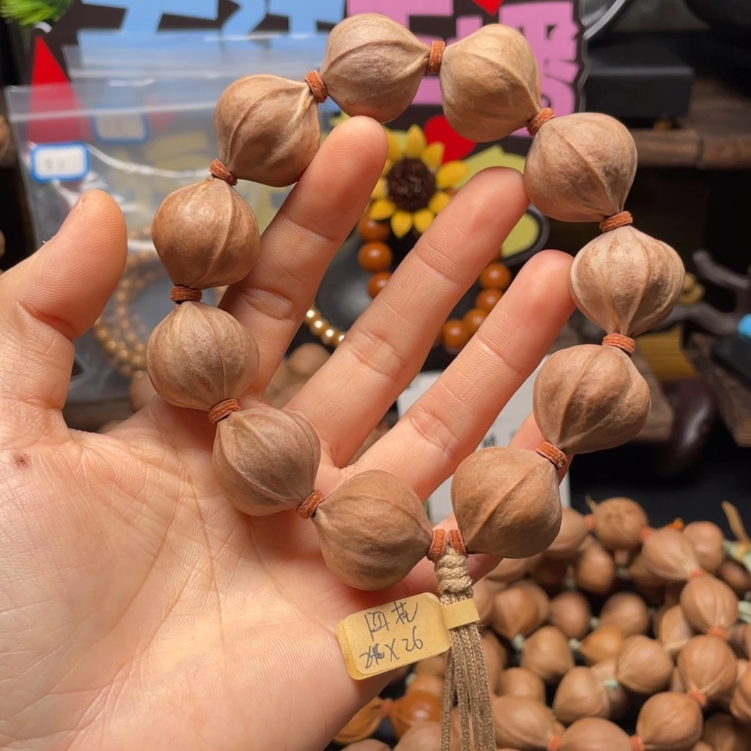 盛***霖橄榄核吊坠2426四花铁核