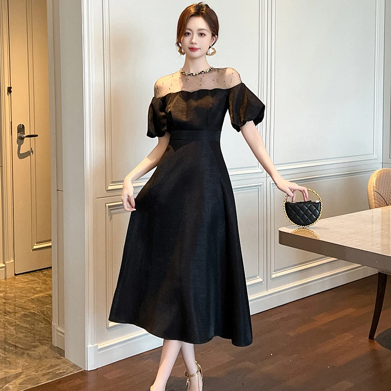 宴会高端礼服裙子女夏季小众气质显瘦长款白色泡泡袖黑色连衣裙
