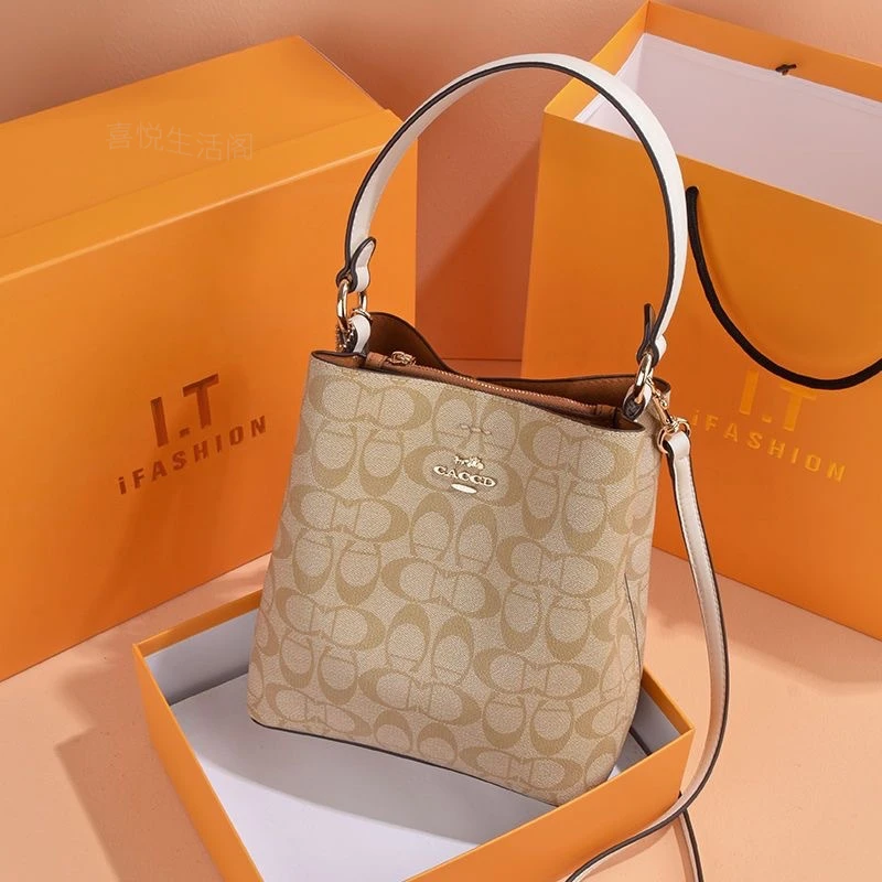 真皮水桶包女包2025新款时尚印花中号深咖色日常搭配腋下包