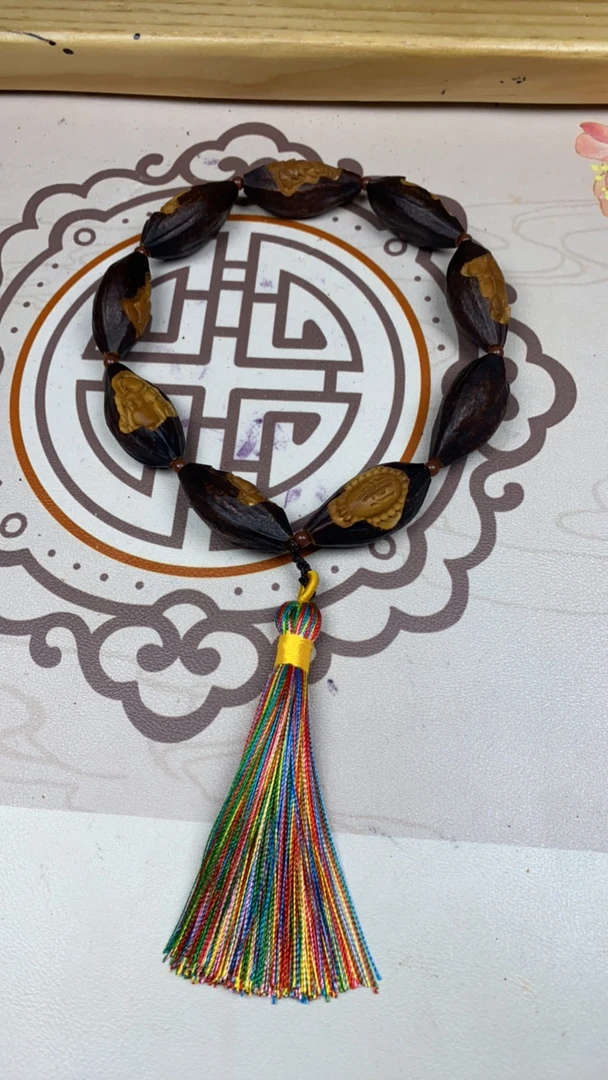 橄榄核雕刻紫皮包衣无相手持强