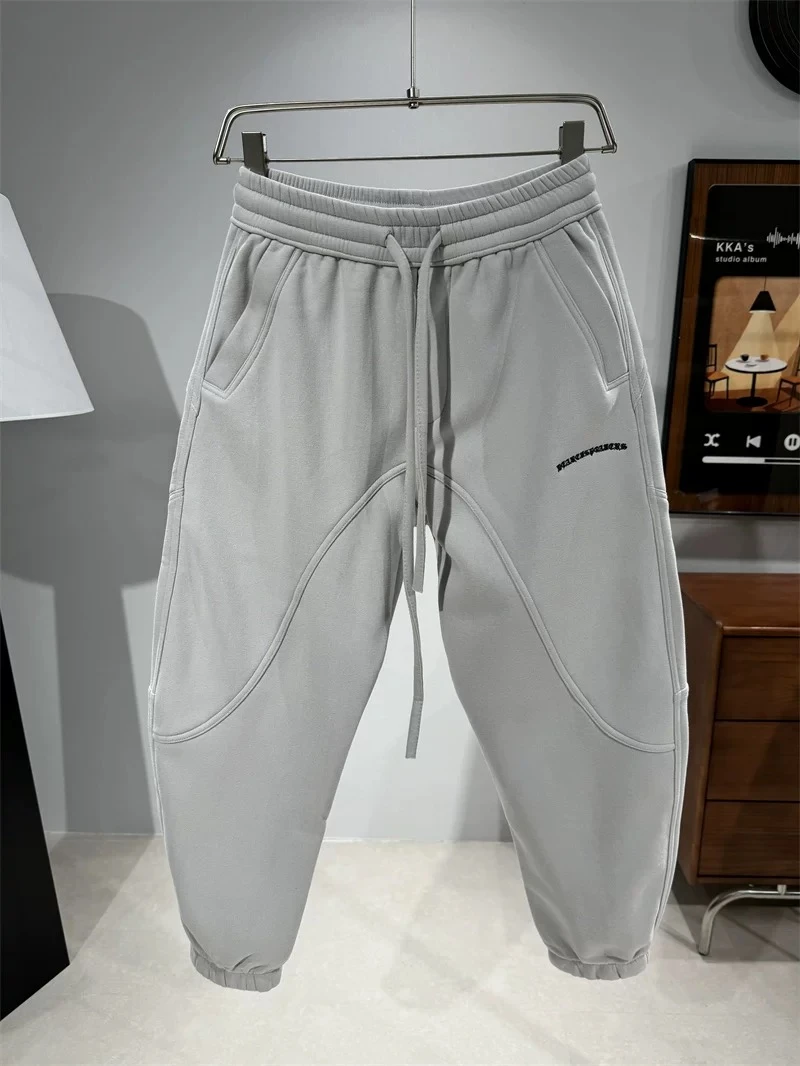 25851微弹浮雕压花束脚卫裤冬季卫裤灰色裤子