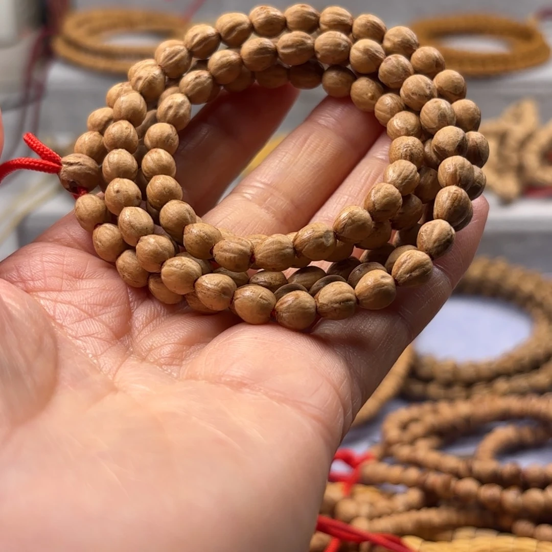 梅***林柏香籽/百香籽吊坠原桩红牙