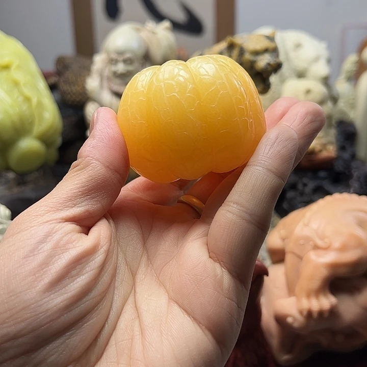 辽宁石阿*罗橘子手把件