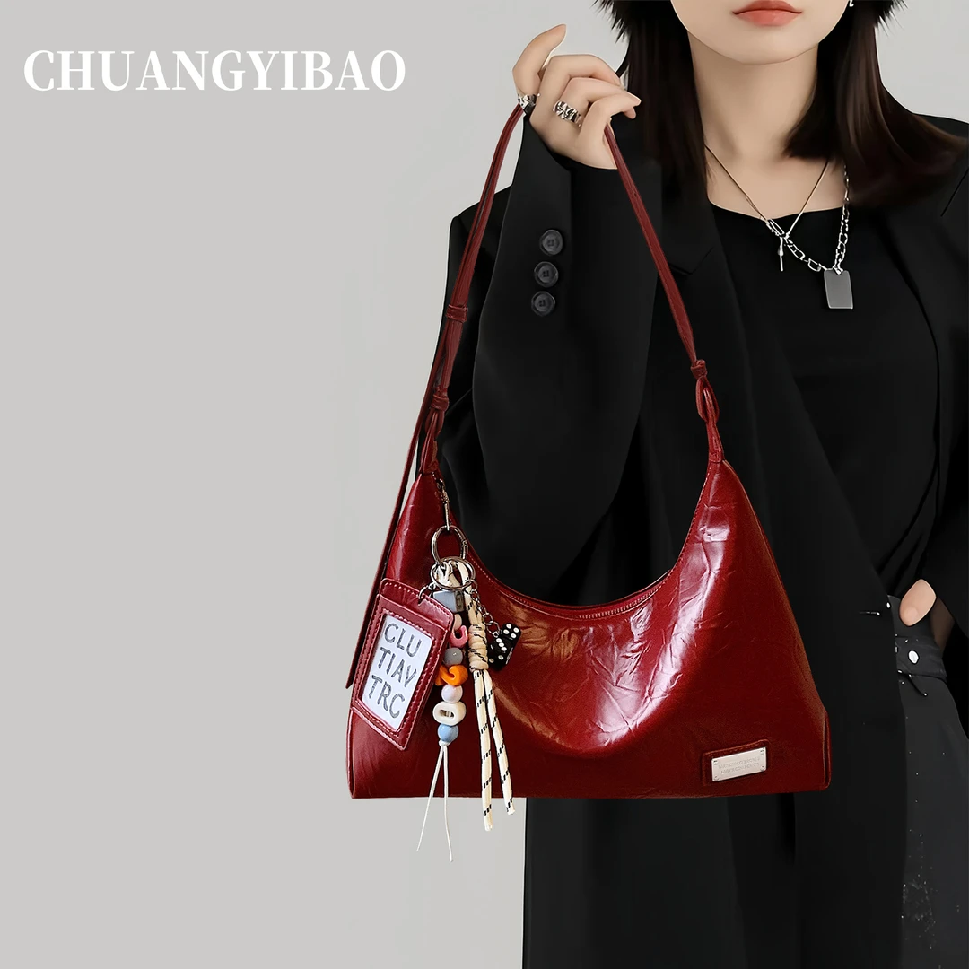 红色腋下单肩包包女2025新款秋冬轻奢小众高级感斜挎饺子新娘婚包