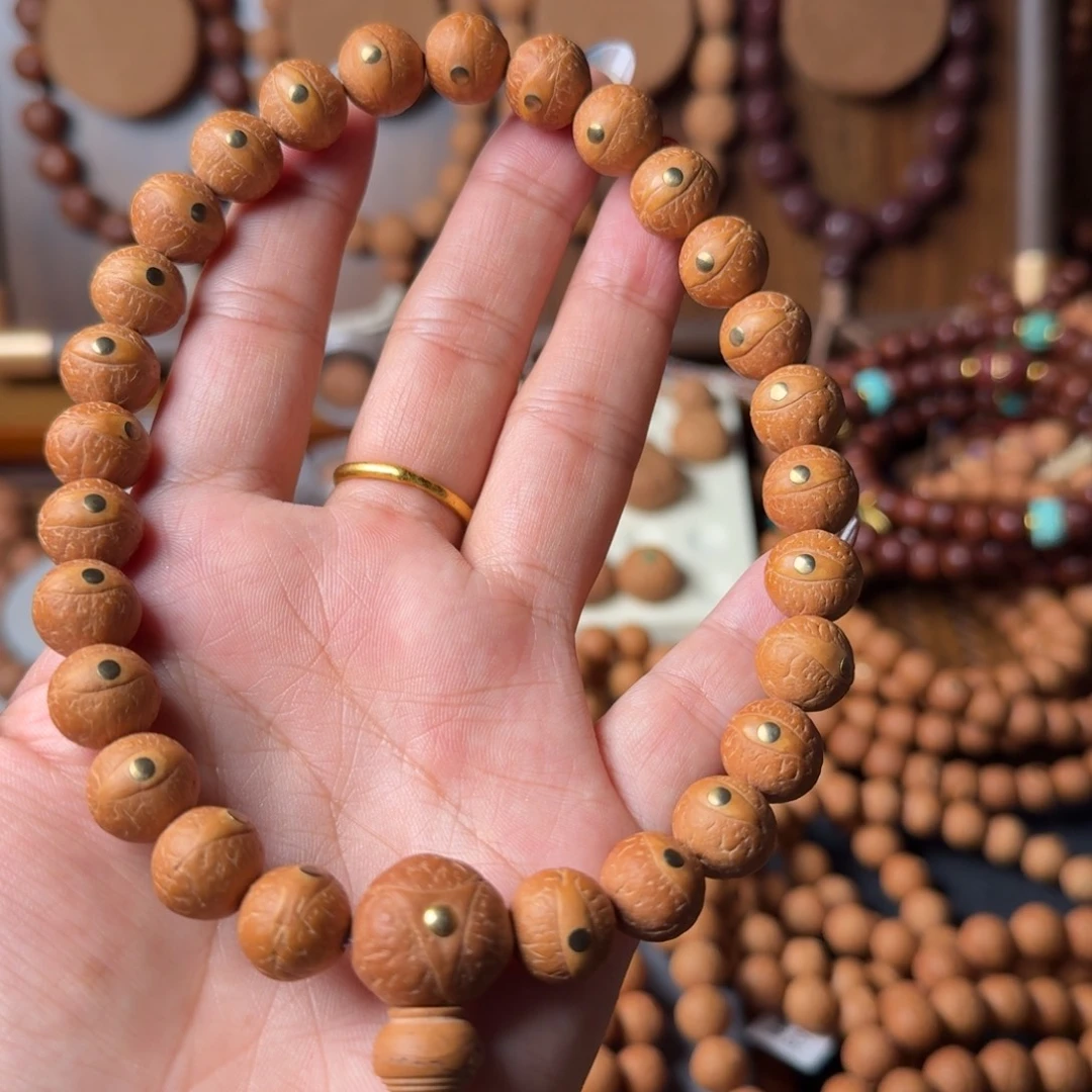 凤眼菩提把件精挑11.5m玉化皮质镶嵌铜钉27颗手持