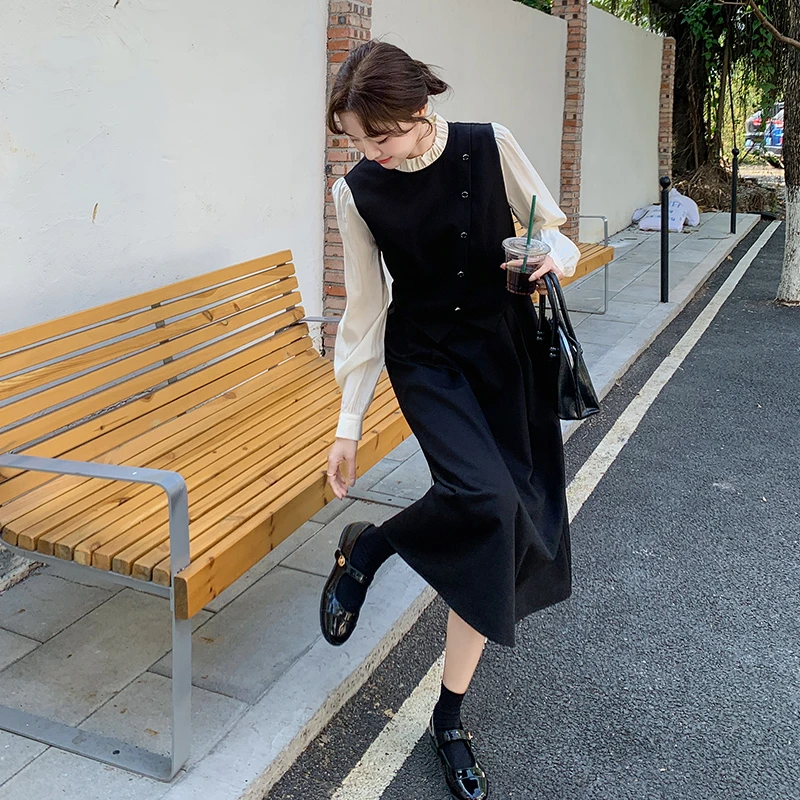 大方得体穿搭2025秋新款撞色拼接假两件木耳边气质法式设计感长裙