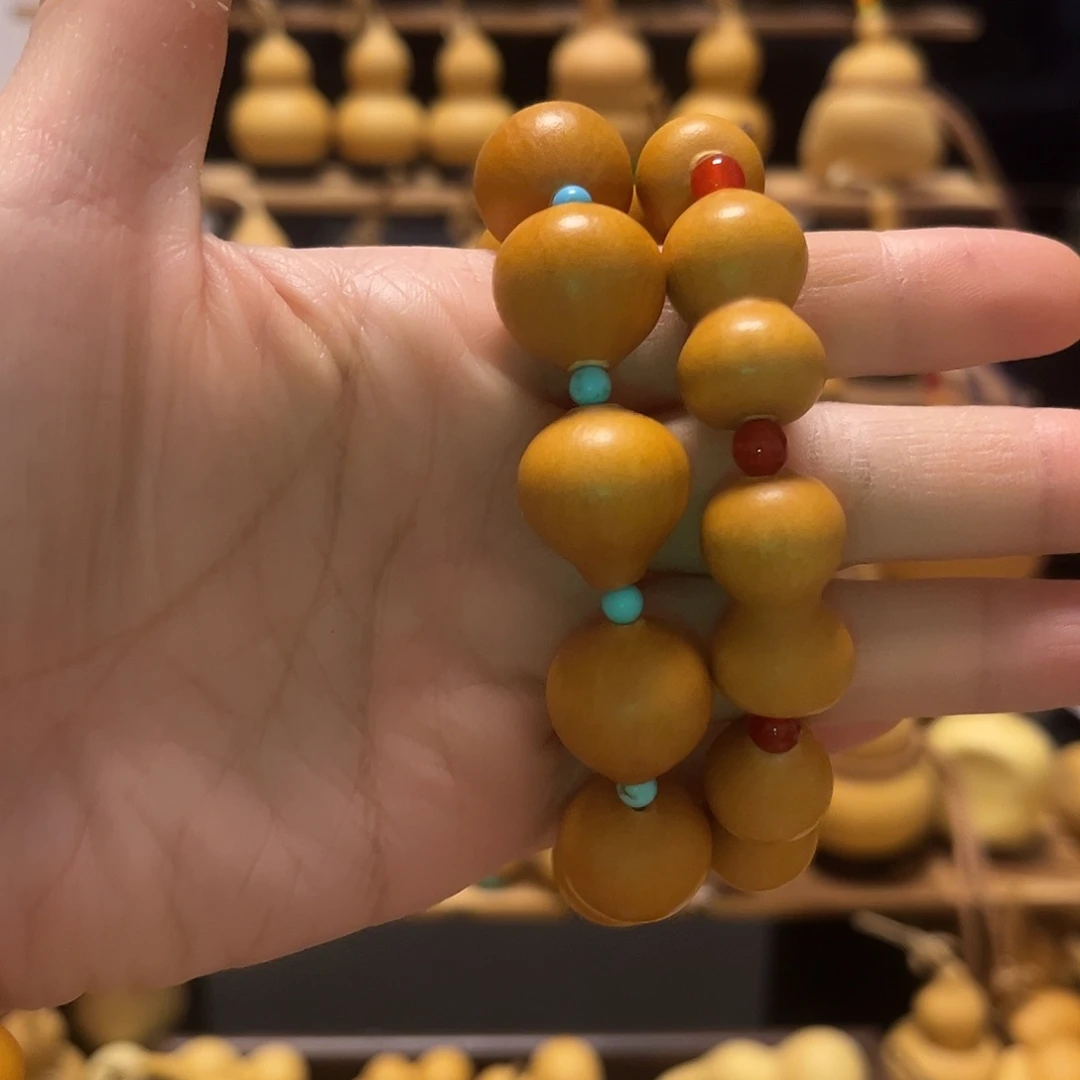 搬***叽精品草里金水滴葫芦手串