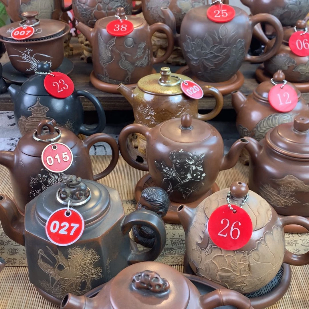 长*弓坭兴陶手工刻绘壶