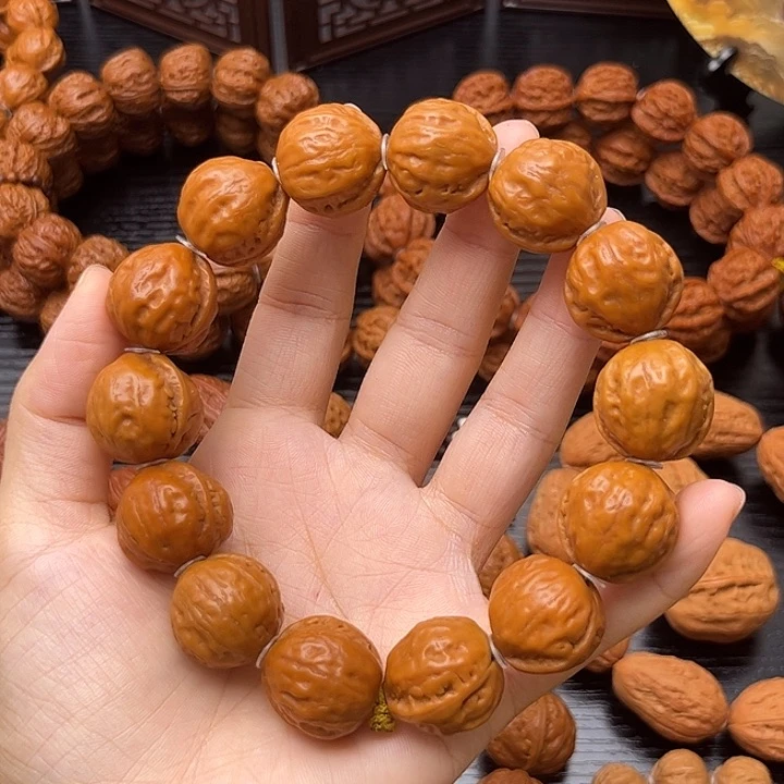 吊坠桃核黄皮光头