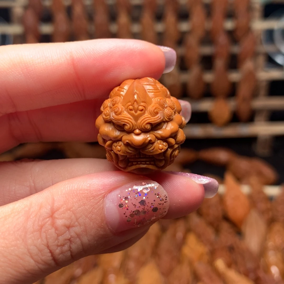 把件橄榄核唐狮三通