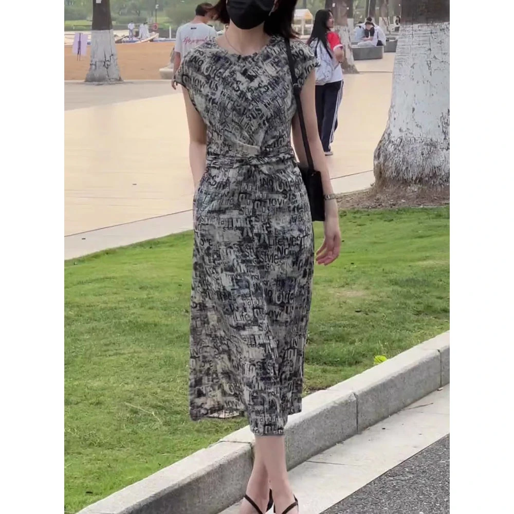 法式高端设计感2025夏季新款洋气百搭显瘦黑色碎花连衣裙中长裙子