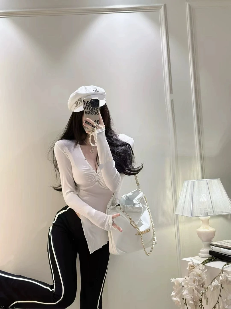 洁哥 新品褶皱下摆设计不规则显瘦上衣