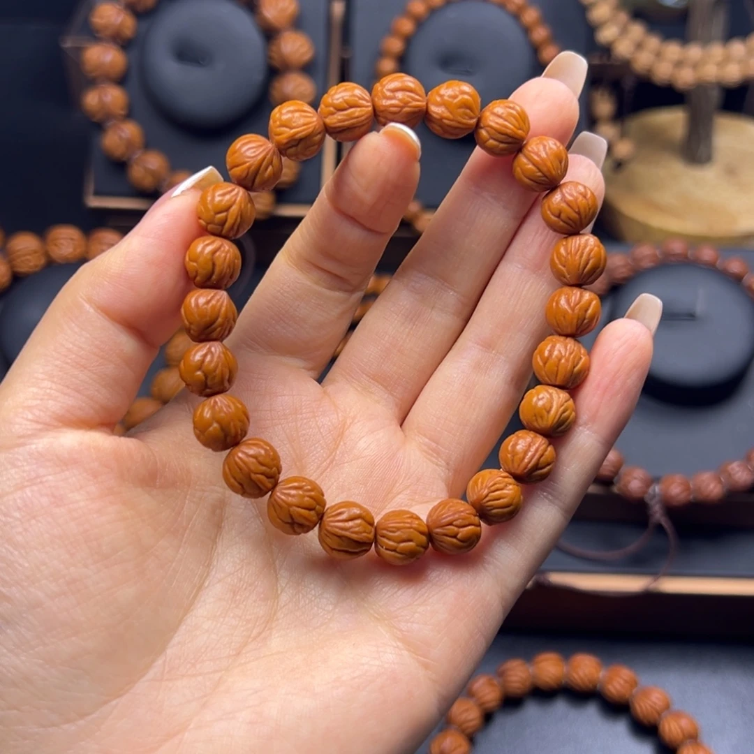 鸿***桃核手串野生玉龙脊10