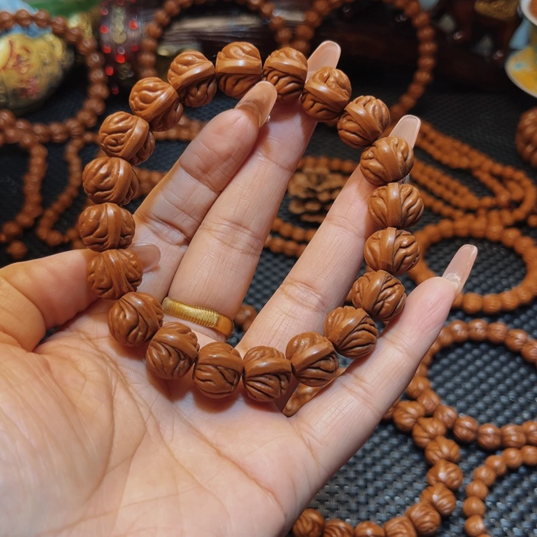 金***）手串桃核15顶级双脊龙单圈