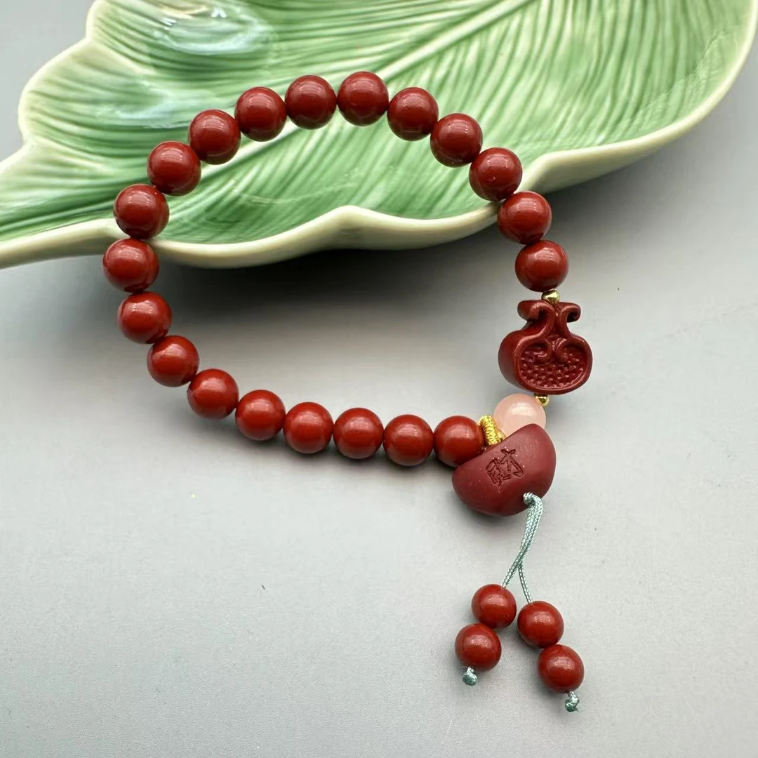 含辰砂工艺品ZA925-紫色圆珠配雕刻元宝提溜8mm手串