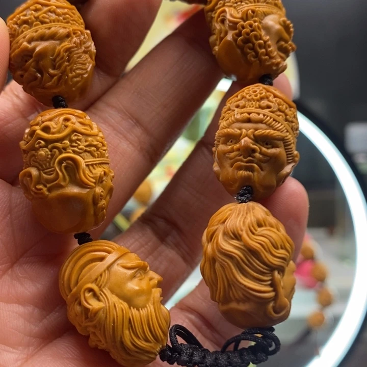 橄榄核吊坠一欢欢回家斤斤计较斤斤计较