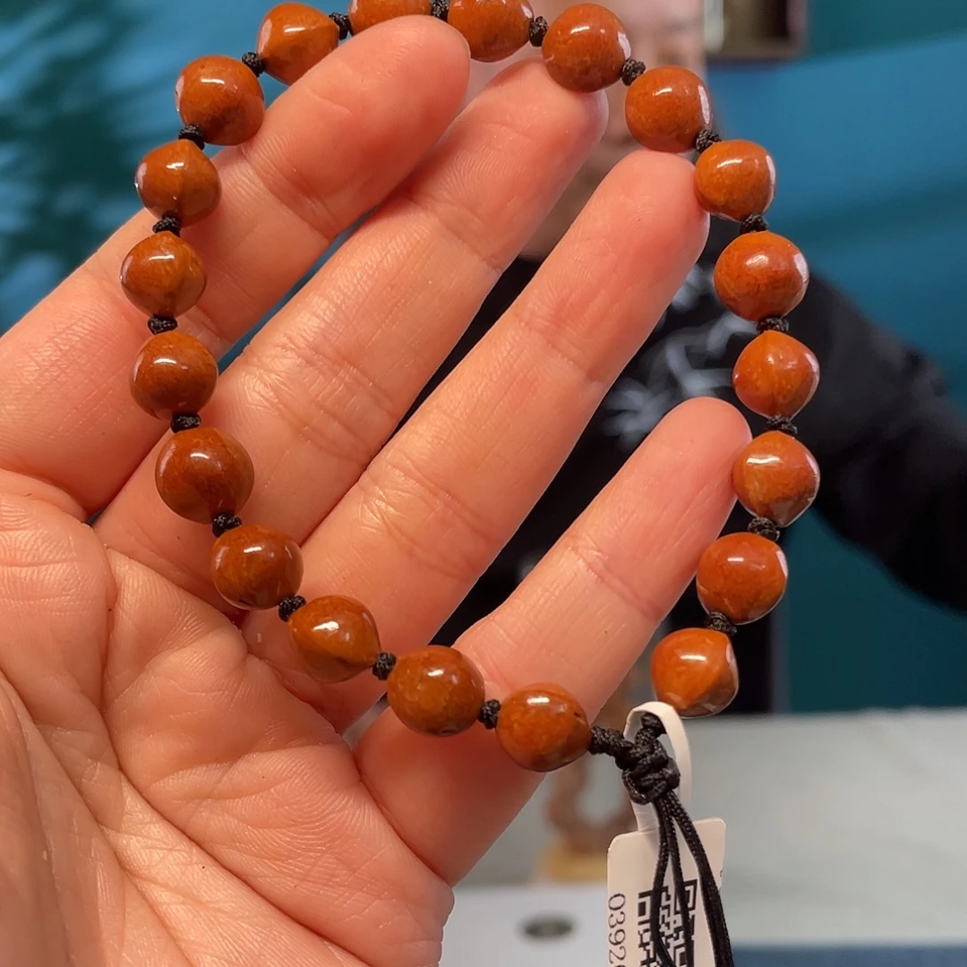 龙纹桃核飞碟珠核雕作品