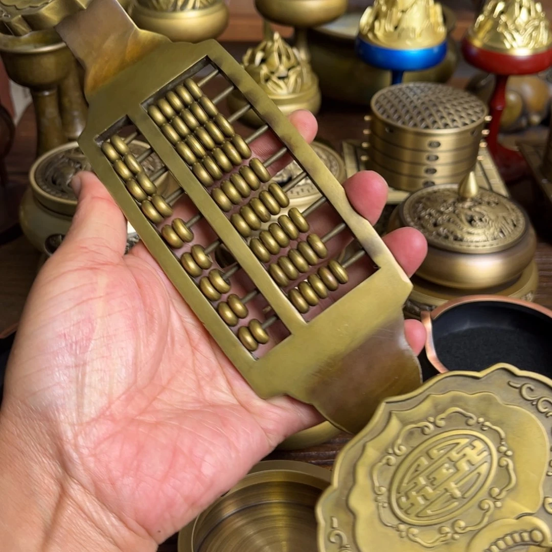 平***人黄铜如意算盘一只