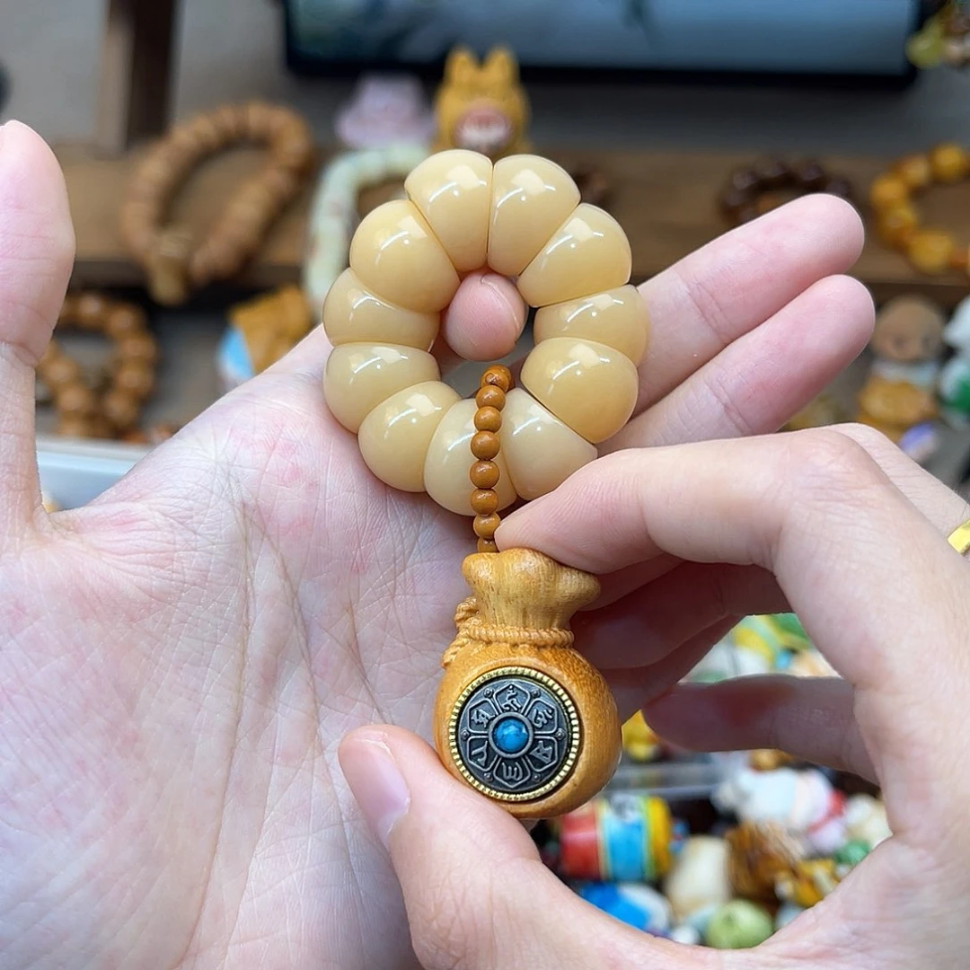 菩提根/象牙果手串月**?手捻福袋