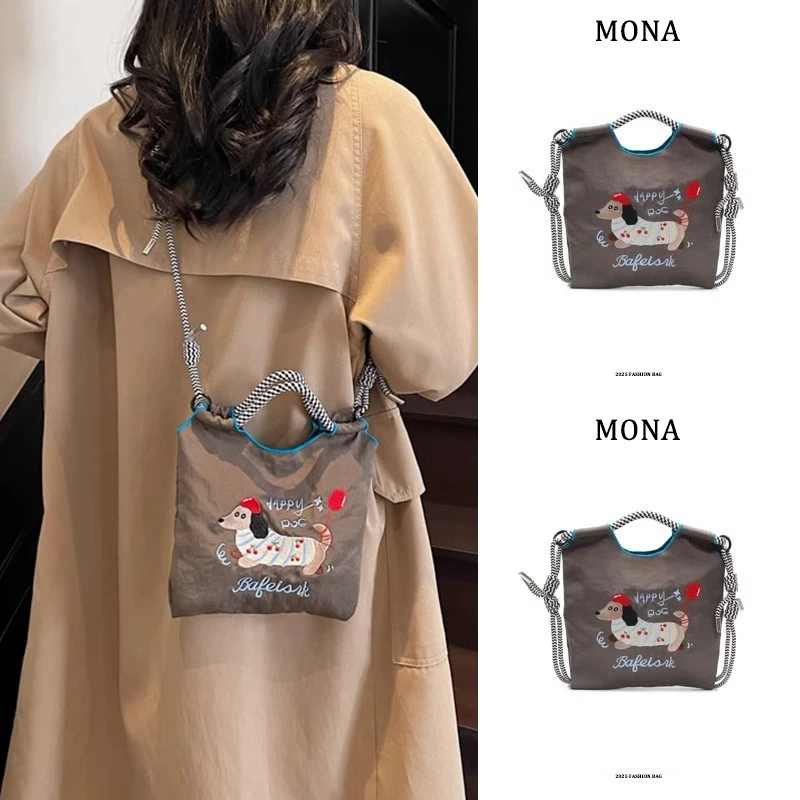 Mona刺绣可爱腊肠狗水桶包包女2025新款手机包百搭通勤单肩斜挎包
