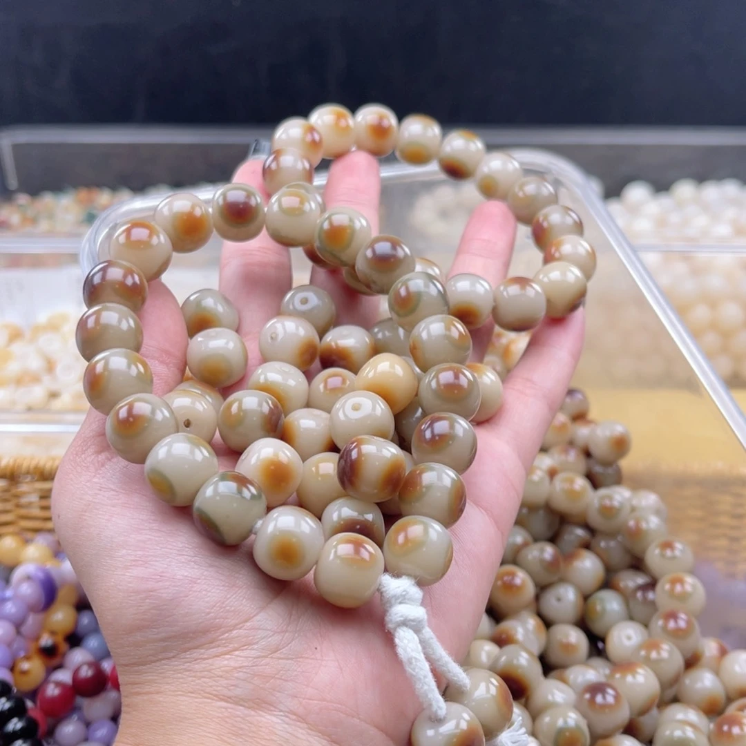 白玉菩提吊坠a14mm20颗。眼睛