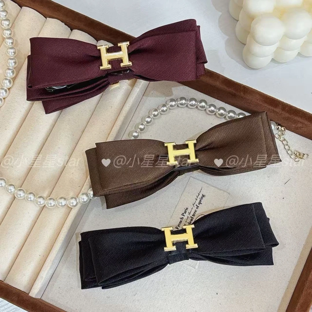 新款原创简约蝴蝶结香蕉夹百搭通勤竖夹气质高马尾