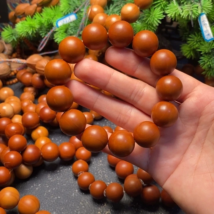 艾***家手串橄榄核1.7福利光珠