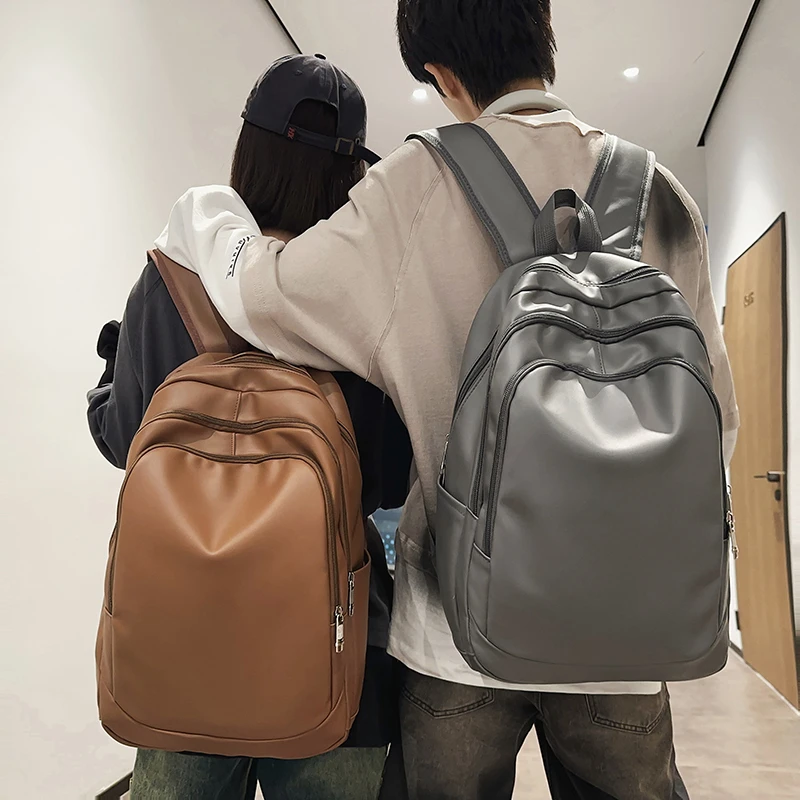 PU女生书包男大学生高级感旅行背包2025新款大容量电脑包双肩包