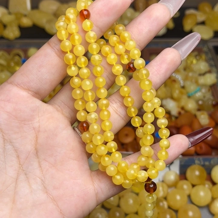 蜜蜡未镶嵌珠宝奇石鸡油黄妖花俏色108颗卡5+微微瑕