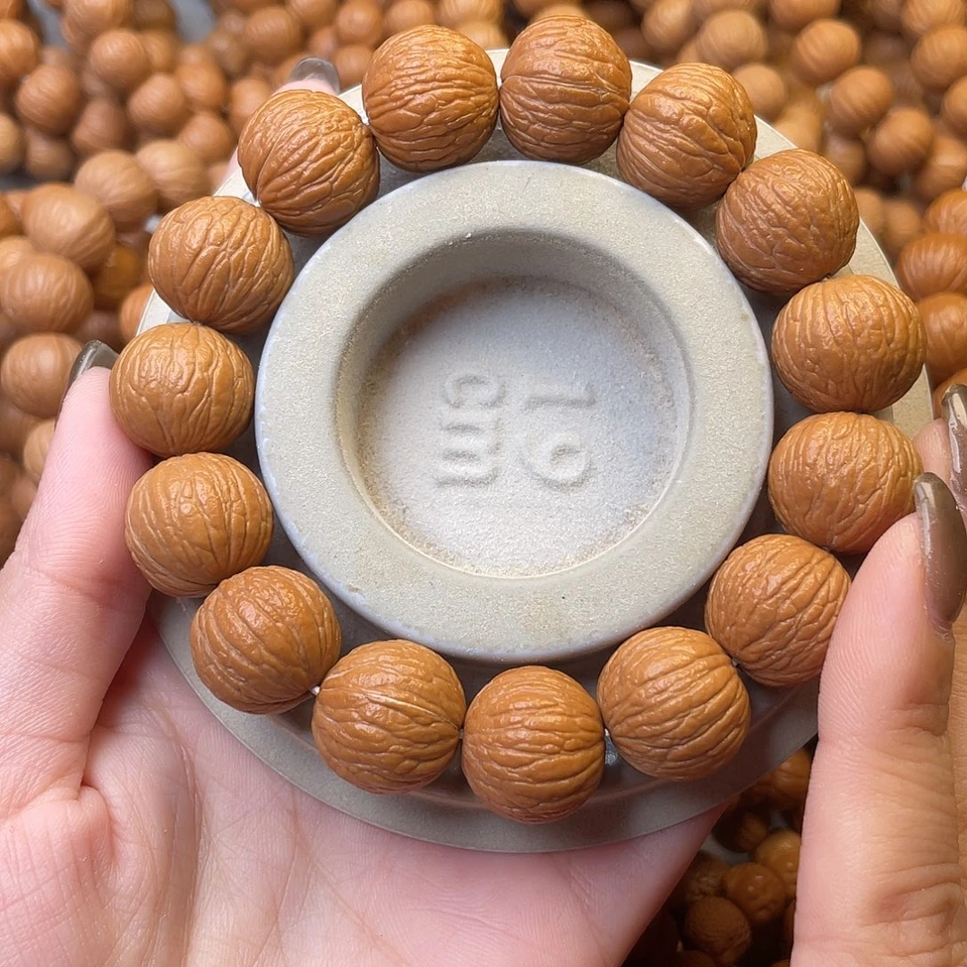 万***光猴头核桃手串凤羽