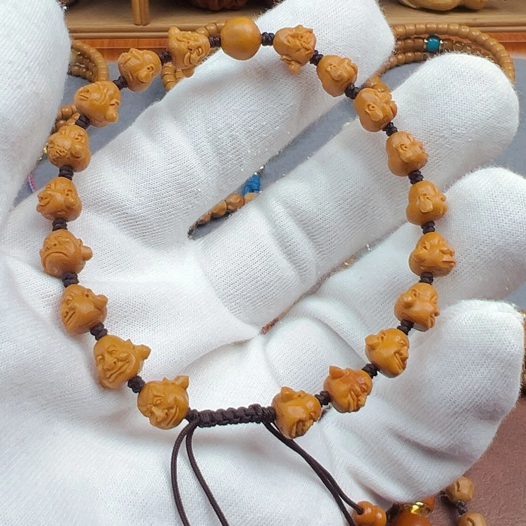 佳***、橄榄核手串橄榄核尖老挝雕刻单圈1.0