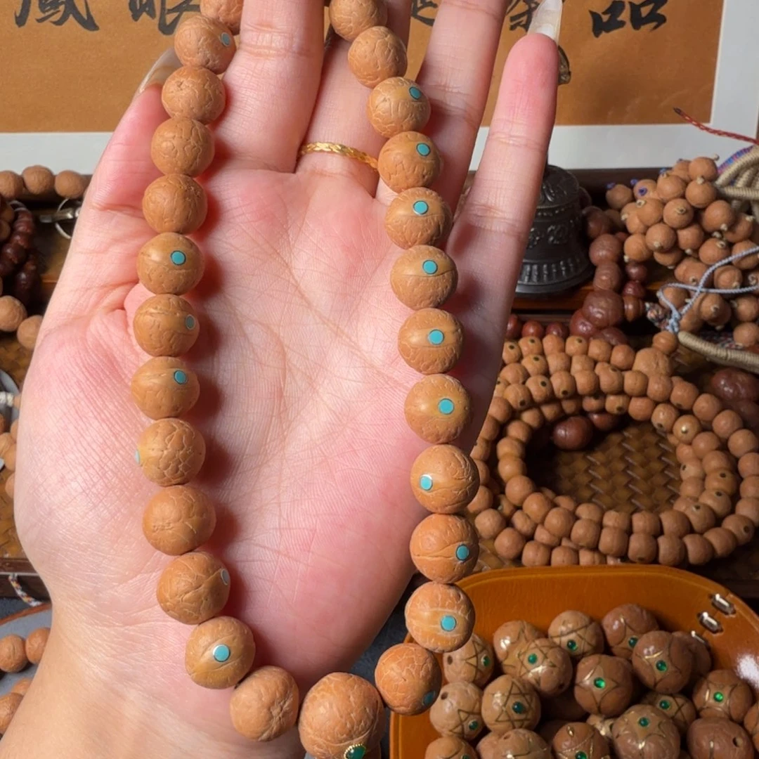 凤眼菩提把件12.5mm 27颗手持 松钉