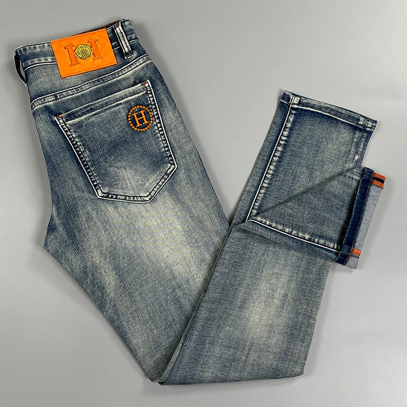 高端牛仔裤男2025春秋款欧货弹力潮牌修身直筒秋季休闲刺绣长裤子